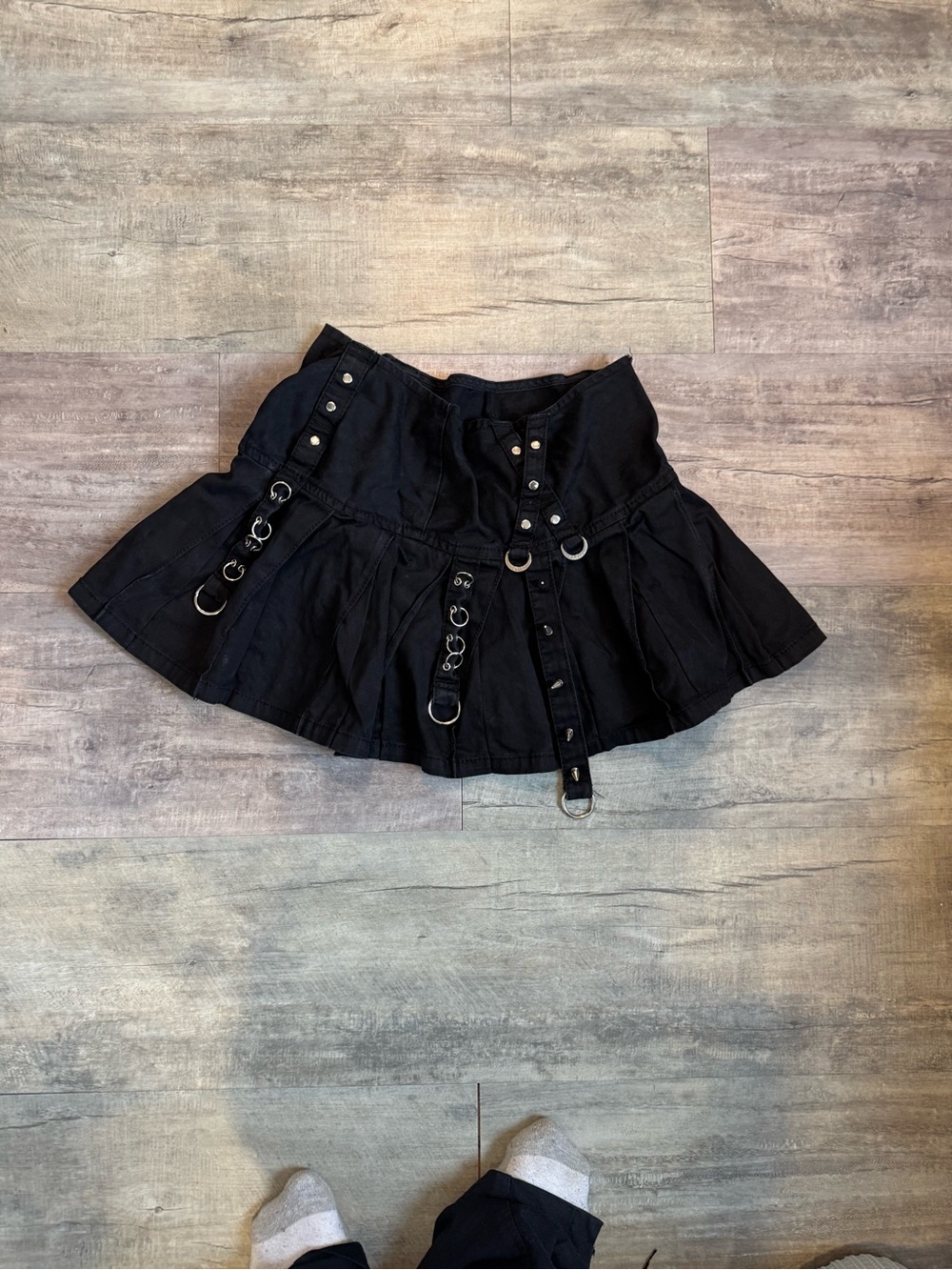Tripp NYC Pleated Mini Skirt with Ring & Strap Details
